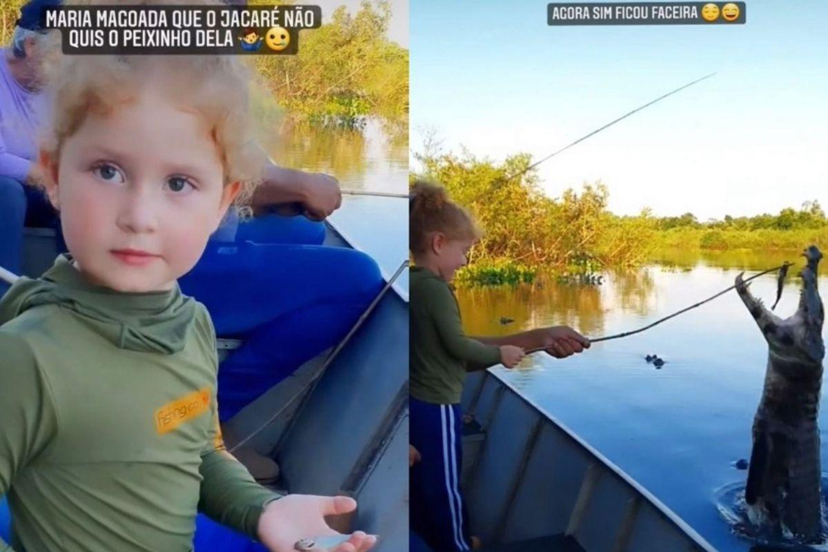 Maria Luiza alimenta o jacaré com piranhas