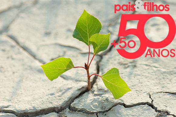 young plant growing through the ground, hope concept