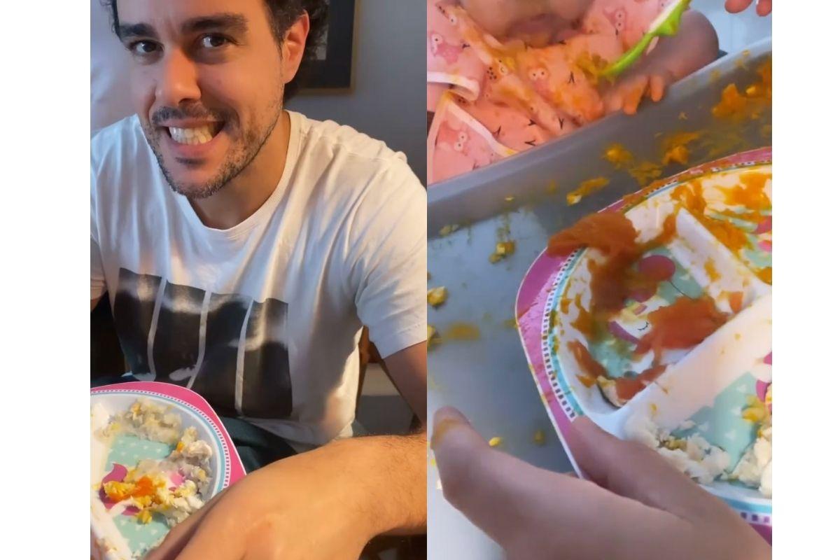 Joaquim Lopes dando comida para as filhas