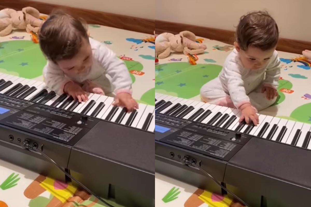Olivia, filha caçula de Daniel, tocando teclado