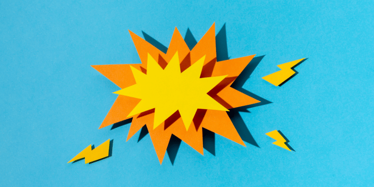 Balão de raiva nas cores amarela e laranja, em um fundo azul.