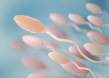 Espermatozoides em fundo azul.